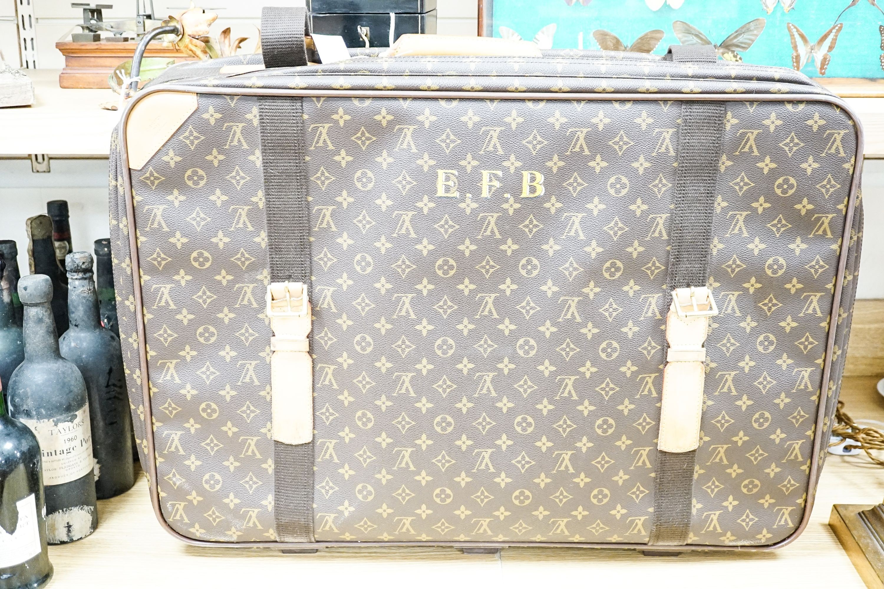 A Louis Vuitton monogram Satellite 70 suitcase initialled ‘E.F.B’ 70x50cm